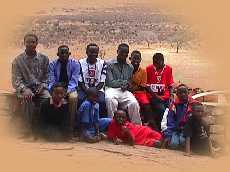 Another group shot with Robert, the reporter overlooking the plains.