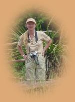 Typical safari wear - female style : 'zippy' trousers ; light weight shirt ; baseball cap ; comfortable footwear